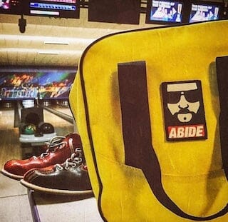 Bowling alley with shoes and bag displaying patch