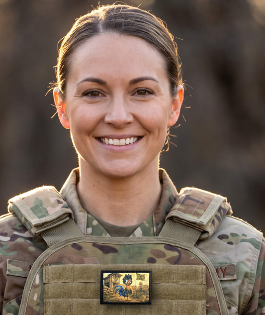 Tactical Chicken Morale Patch with hook-and-loop backing shown on a plate carrier attachment point