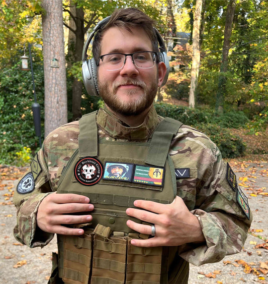 Ukraine 'PMC Boykisser Group' logo on a tactical morale patch on a tactical vest