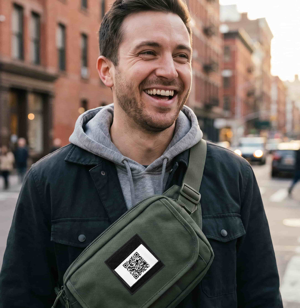 Rick Roll Qr Code Morale Patch attached to a man's tactical backpack