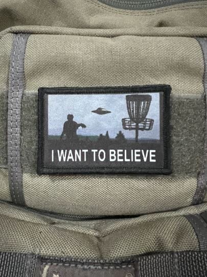 Elevate your disc golf game with the 'I Want To Believe' Disc Golf Morale Patch from RedHeadedTshirts.com.