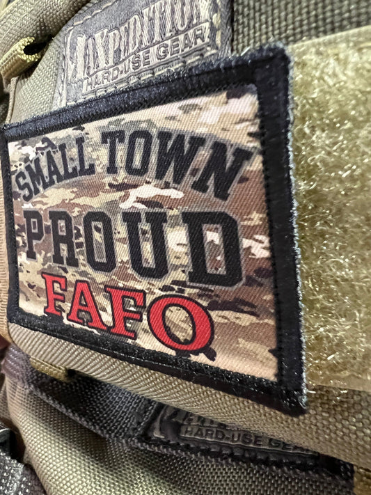 Show your Small Town Pride and patriotic spirit with RedheadedTshirts.com's Multicam Small Town Proud Velcro Morale Patch. Inspired by the anthem "Try that in a small town," this patch celebrates conservative values and the unyielding spirit of America's