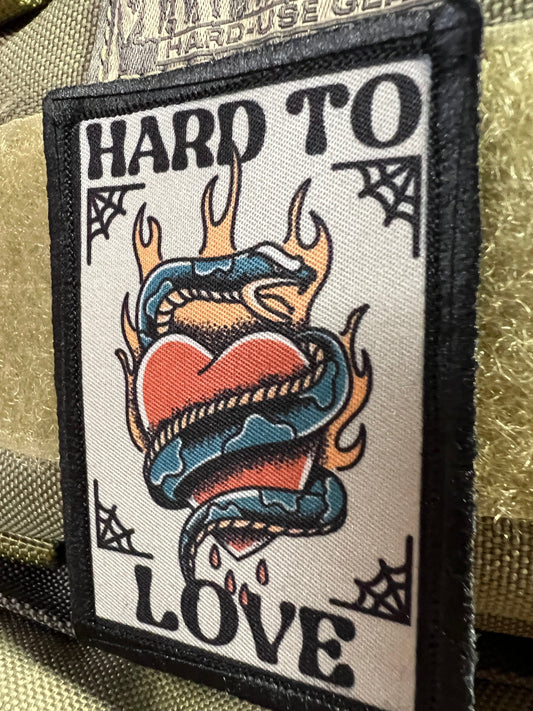 Your Let out Mischievous Charm with RedheadedTshirts.com's "Hard To Love" Tattoo Velcro Morale Patch!