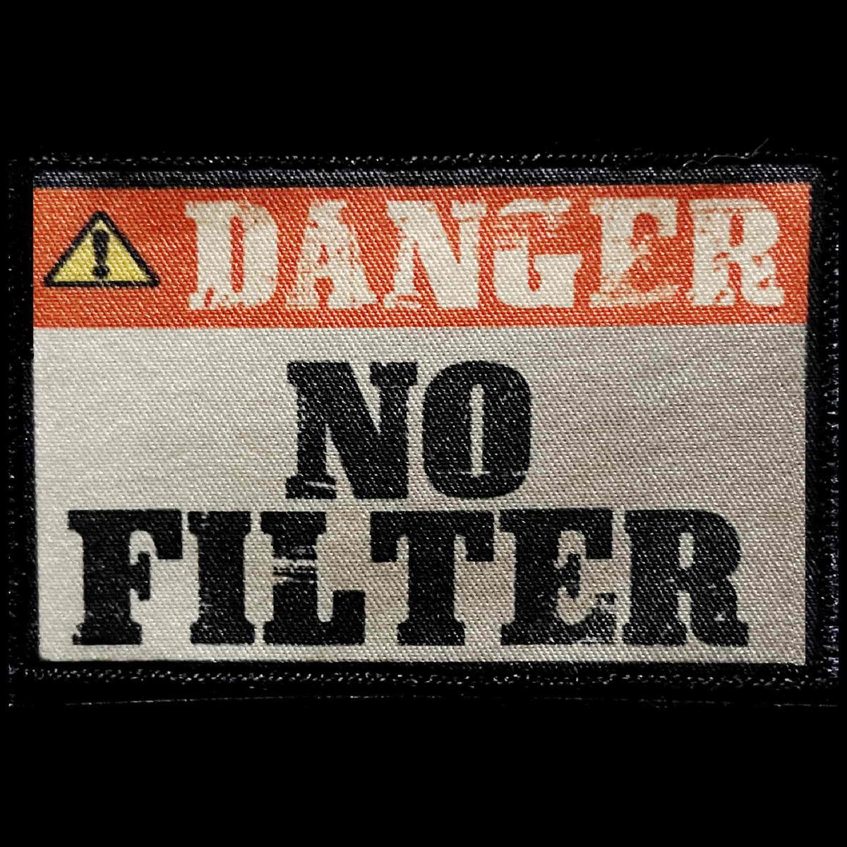 
DANGER NO FILTER HUMOR — A funny morale patch styled like a bold workplace hazard warning sign for blunt, outspoken people who speak their minds and rarely apply a social filter.
