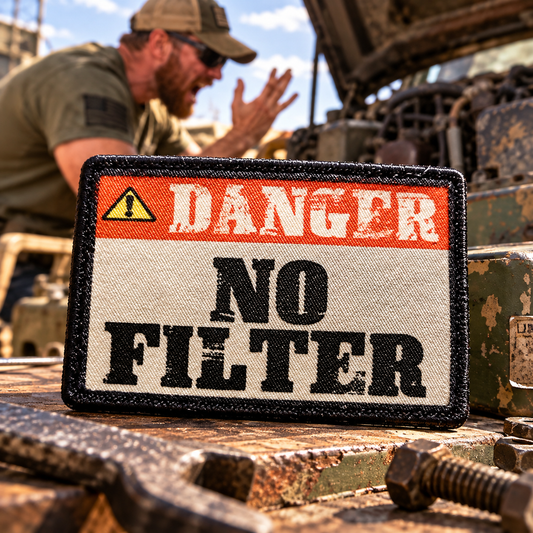 Danger No Filter morale patch displayed on a backpack loop panel with bold orange warning-sign artwork