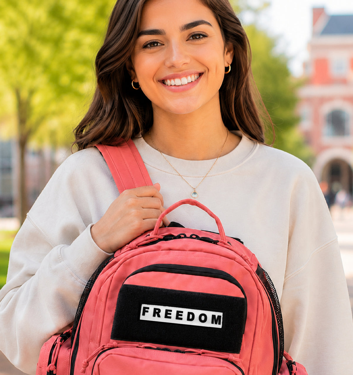 Charlie Kirk Freedom 1x4 Hook and Loop Morale Patch on woman's pink backpack