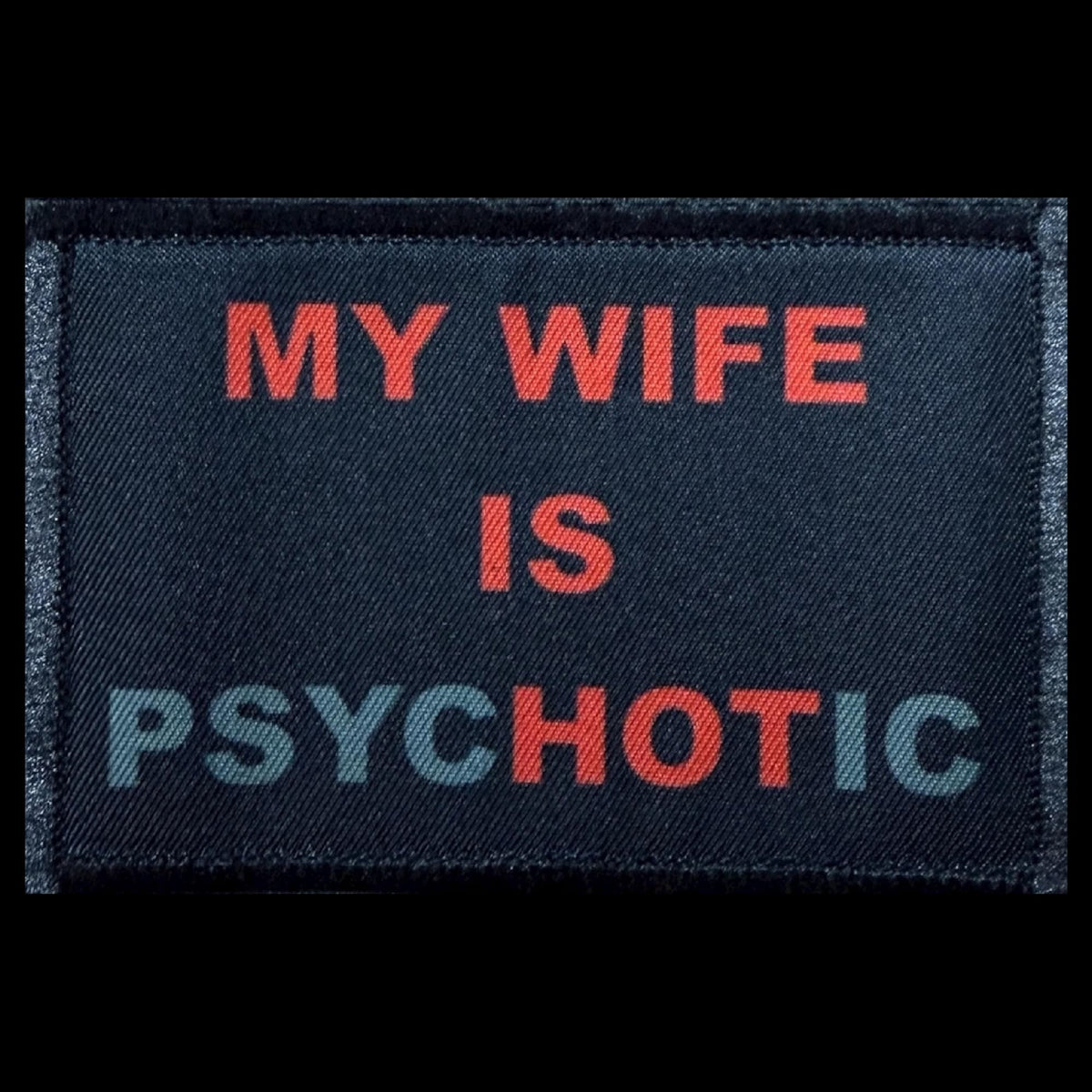 My Wife Is PsycHOTic morale patch with HOT highlighted in red on a black background