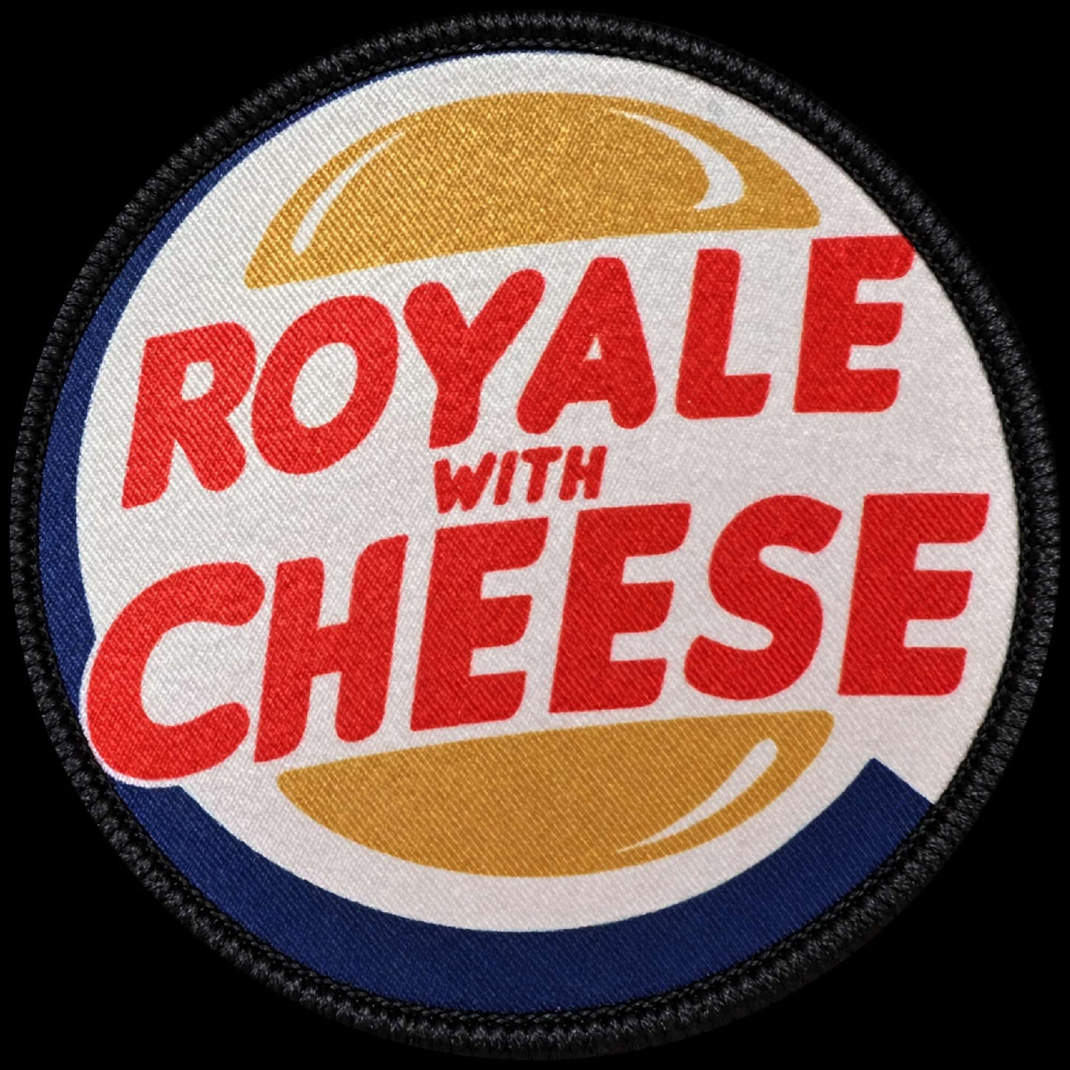 Main image of the Royale with Cheese morale patch with bold red lettering and golden hamburger bun graphics