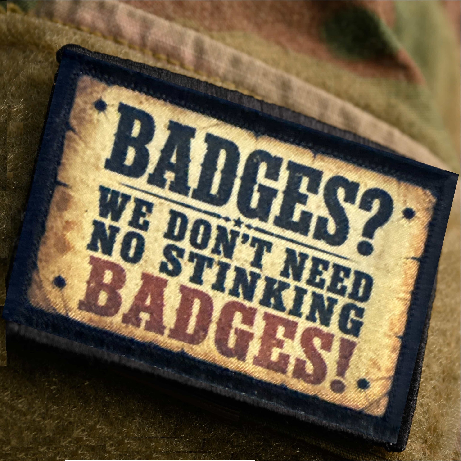 Badges? We Don't Need No Stinking Badges Hook and Loop Morale Patch on a multicam velcro area on sleeve