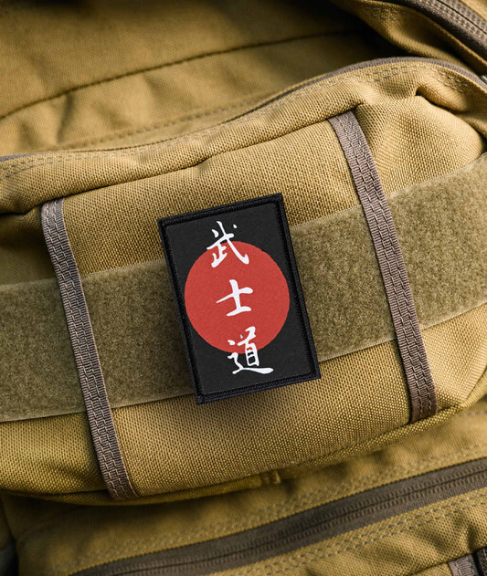 Code of Bushido morale patch displayed on a backpack with Japanese kanji and bold red sun artwork