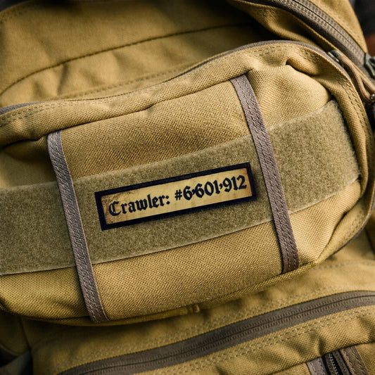 Dungeon Crawler Carl Dungeon Crawler Number 6,601,912 Morale Patch on tan backpack