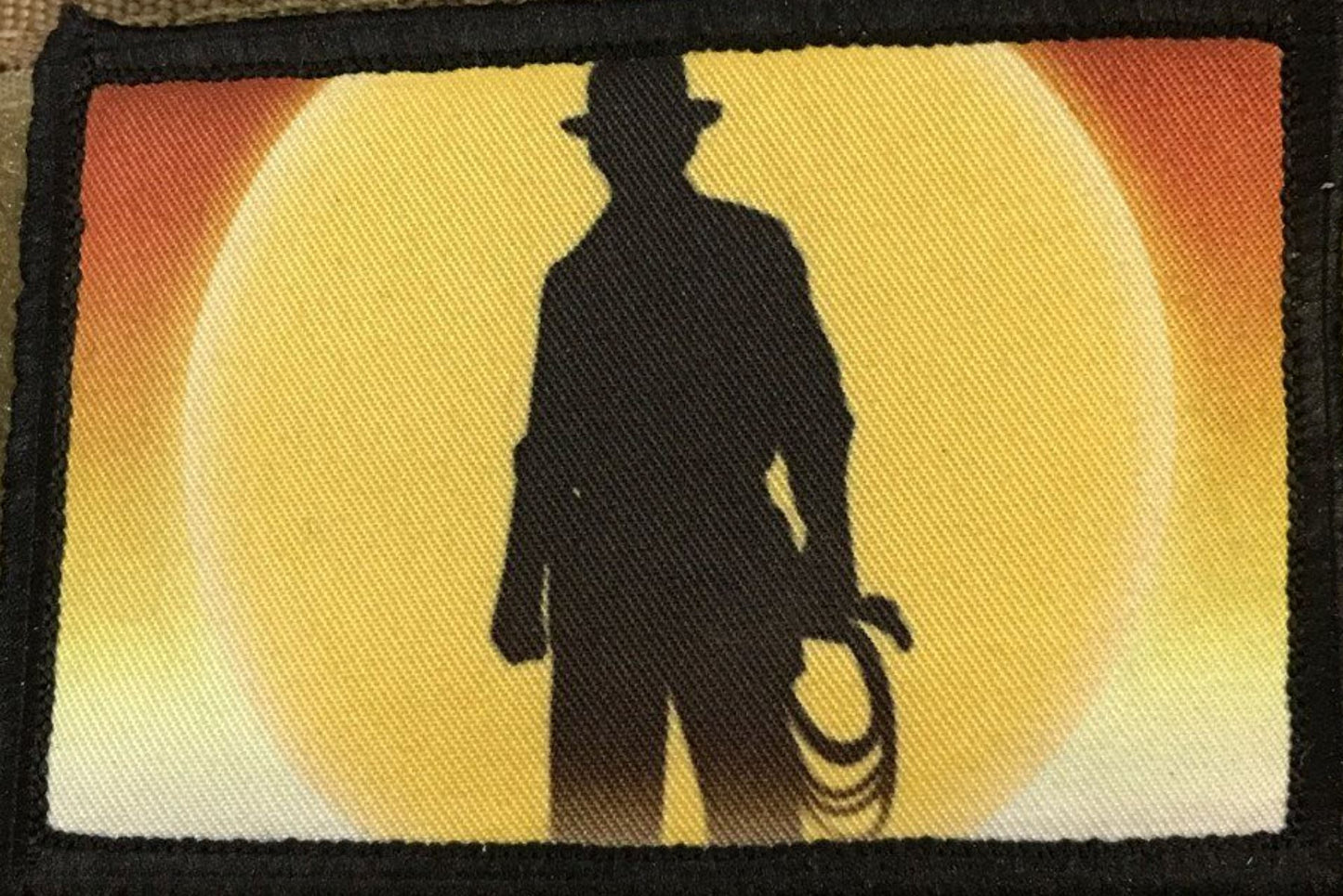 Patch featuring silhouette of iconic Indiana Jones with the sunset in the background.