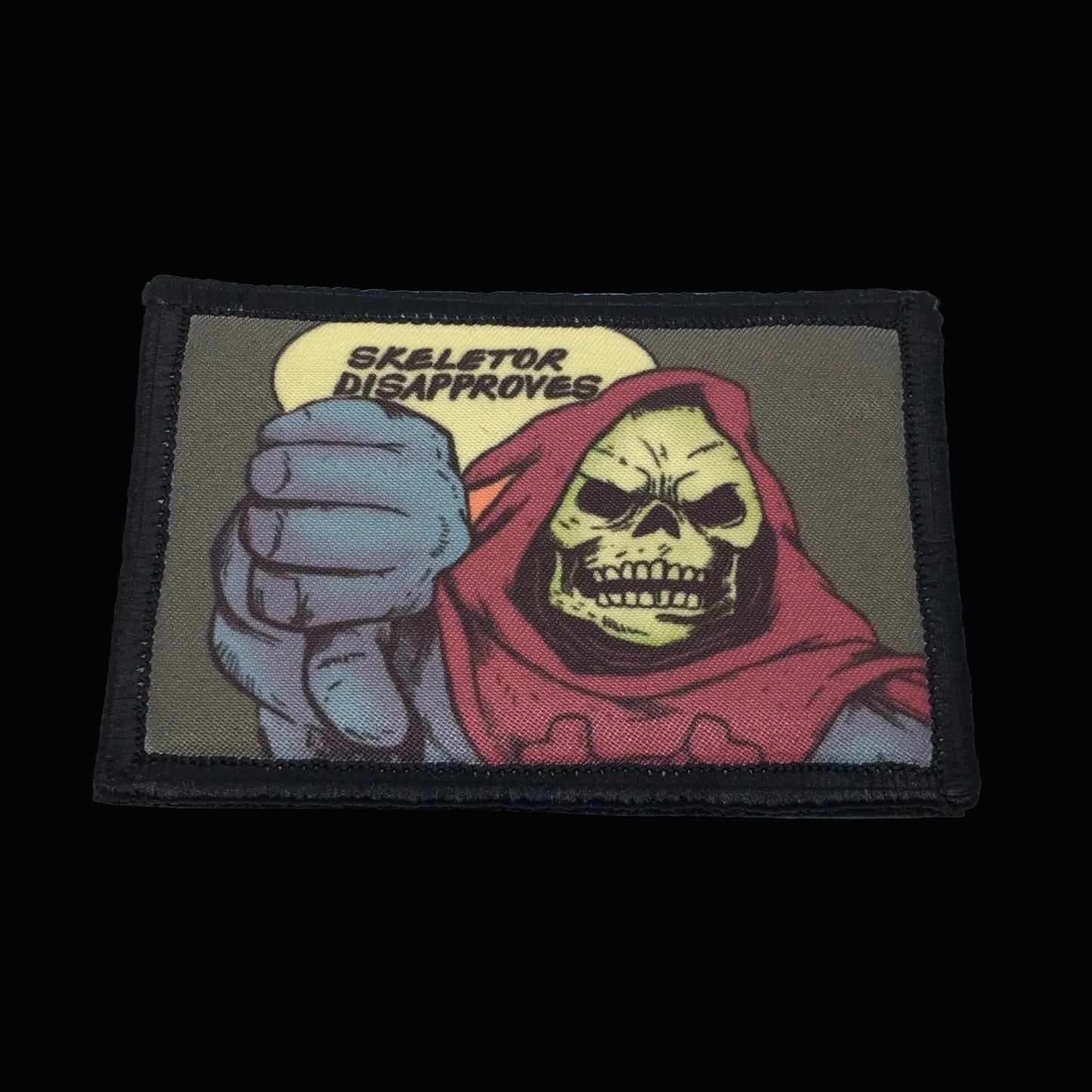 Morale Patch with Skeletor character from Masters of the Universe series, showing a fist with a speech bubble saying 'Skeletor Disapproves'.
