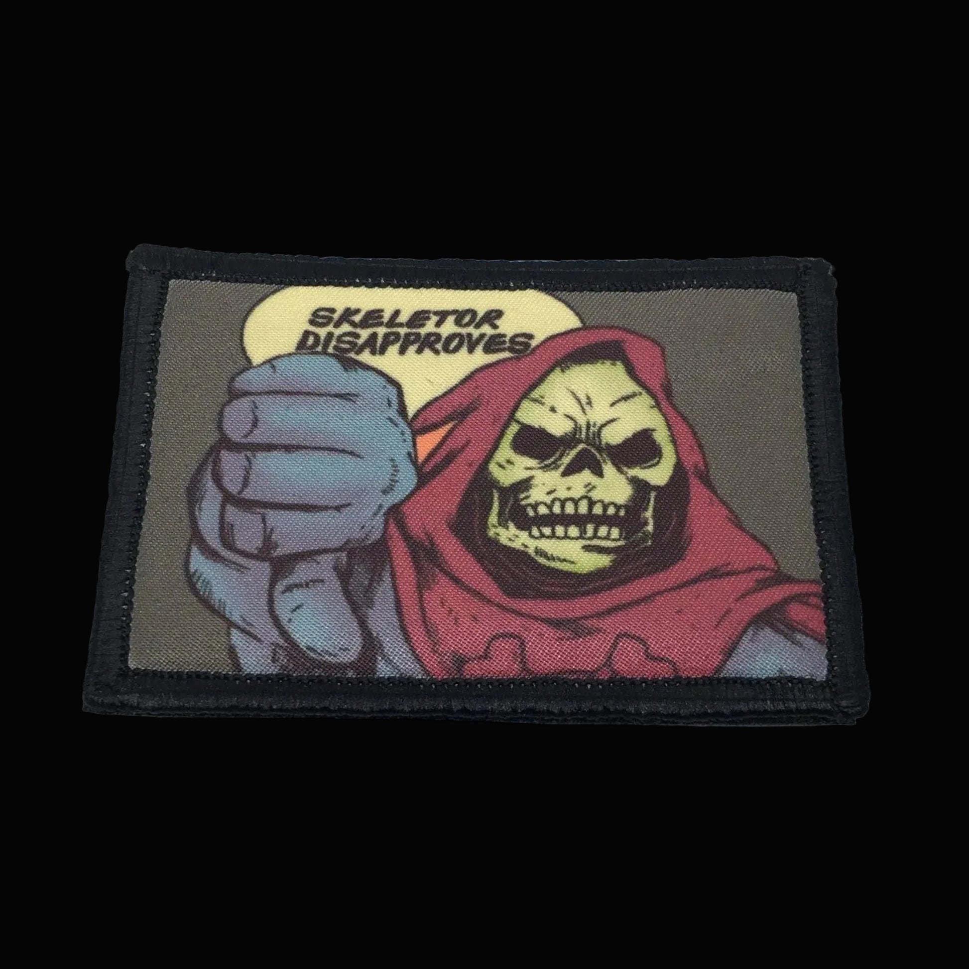 Morale Patch with Skeletor character from Masters of the Universe series, showing a fist with a speech bubble saying 'Skeletor Disapproves'.